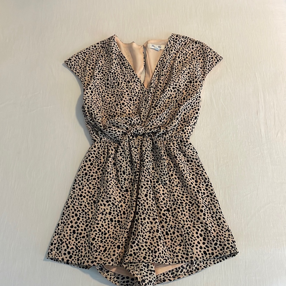 Adorable animal print romper.